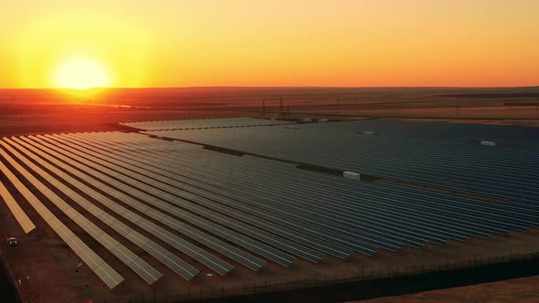 Top View of a Massive Solar Power Facility at Sunset