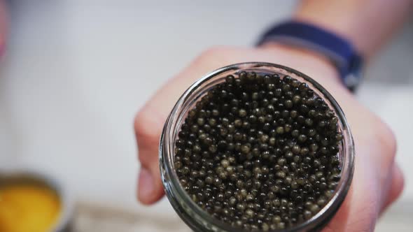 open can of black caviar