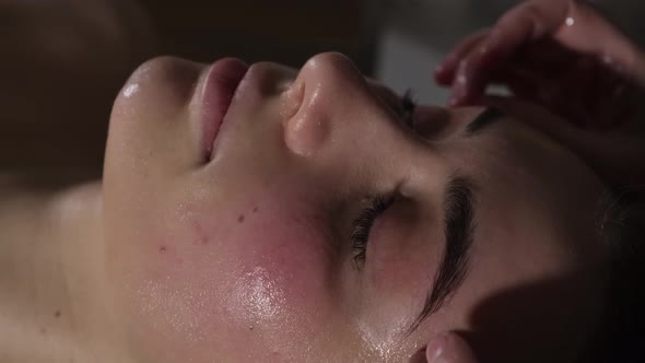 Acupressure Massage of a Woman's Face