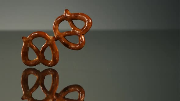 Pretzels falling and bouncing in ultra slow mo 