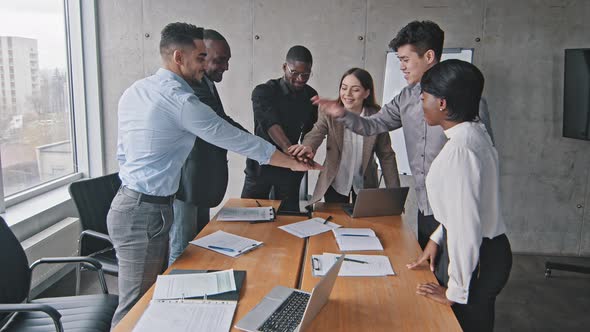 Multiethnic Businesspeople Business Team Group of Coworkers Colleagues Putting Their Hands on Top of