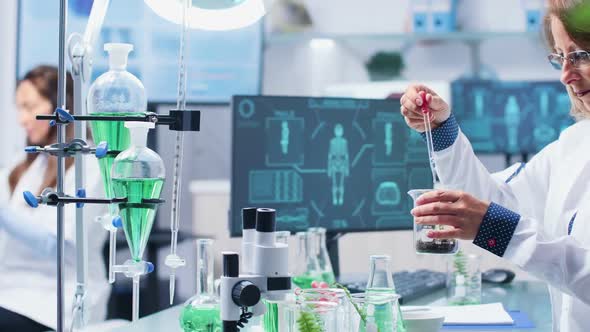 Close Up Shot of Female Chemist Making Experiment on Plants alt