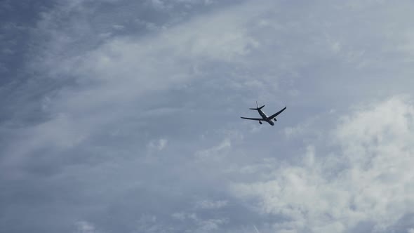 Plane Flying High in Sky