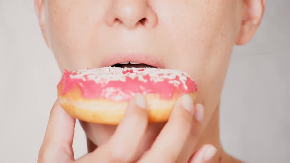 Close Up Face Young Woman Eating Doughnut