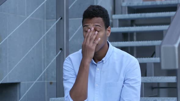 Frustrated, Tense Unsatisfied Young Black Man Sitting on Stairs, Portrait