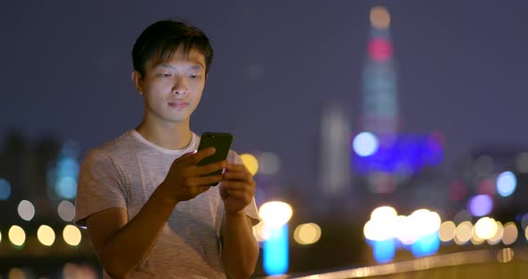 Man use of cellphone at night