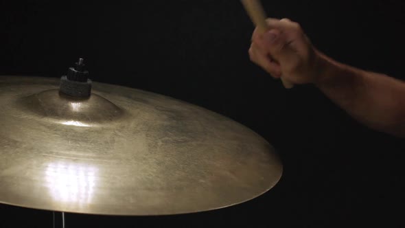 Close Up of Guy Beating Drum with Drumstick Slow Motion