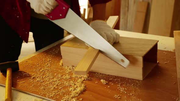 Woodwork and furniture making concept. Stylish craftsman working in his carpentry workshop