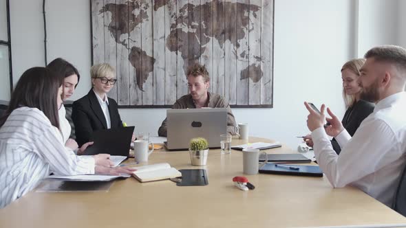 Group of Young People Are Discussing Something in a Modern Office