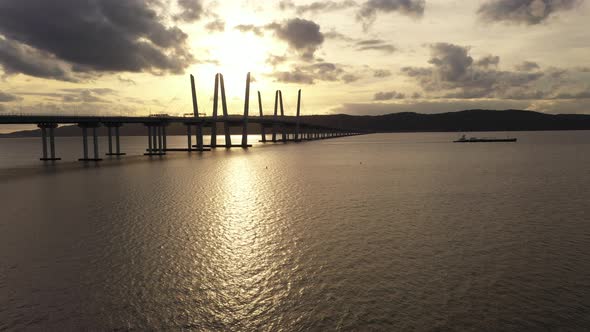 An aerial shot of the Mario M. Cuomo Bridge on the north side. The drone camera dolly in over the Hu