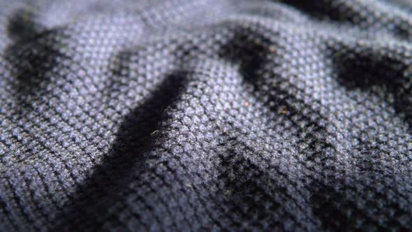 Knitted wool background. Soft, blue, navy, woolen, merino clothes texture, fabric sweater