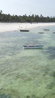 Vertical Video Boats in the Ocean Near the Coast of Zanzibar Tanzania