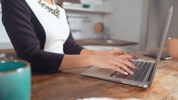 Relaxed Female Checking E-mail and Typing on the PC at the Office