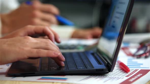 Businesswoman Typing On Laptop