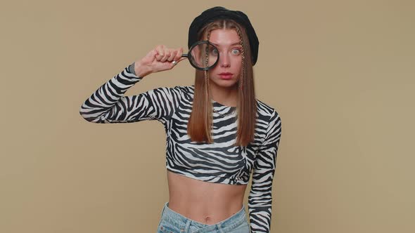 Researcher Scientist Woman Holding Magnifying Glass Near Face Looking to Camera with Big Zoomed Eye