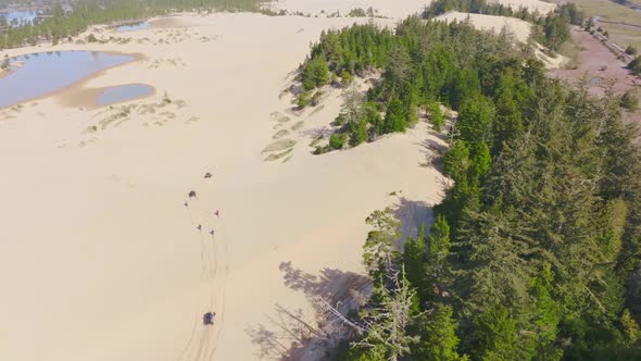 Video clip at the Oregon Dunes by North Bend, Oregon following ATV riders.