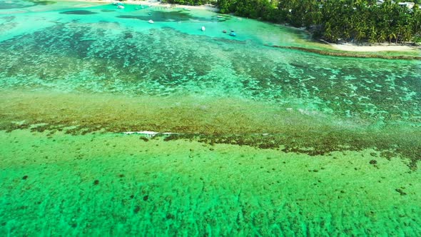 Aerial travel of paradise seashore beach holiday by blue water with white sandy background of a dayt