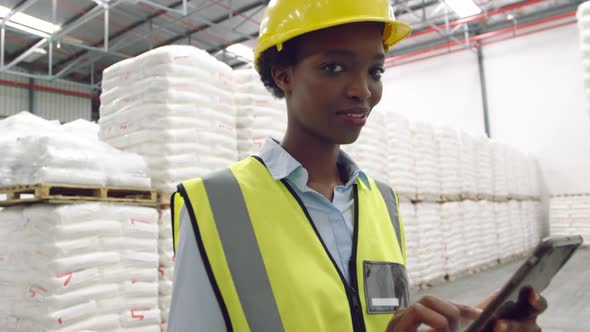 Portrait of young female manager in a warehouse