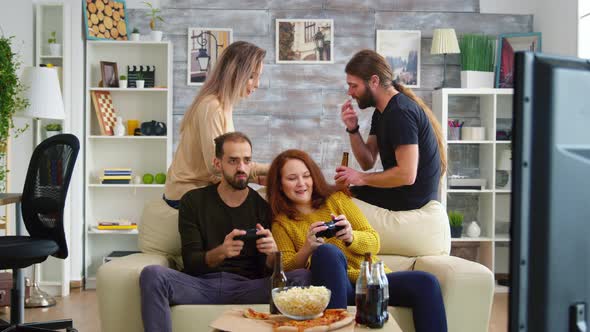 Girlfriend with Red Hair Trying To Beat Her Friend While Playing Video Games