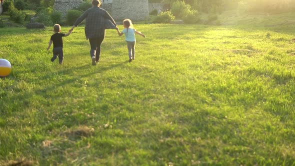 Summer Nature Happy Family Mother Day Pregnant Woman Mom with Two Toddler Children Running Holding