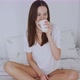 Calm Inspired Woman Having Hot Drink on Bed in Morning - VideoHive Item for Sale