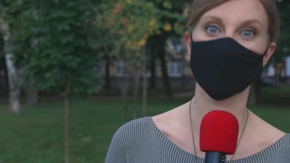 Young Pretty Woman Talking With Microphone