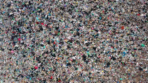 Aerial view, Flocks birds fly over a giant landfill of household waste