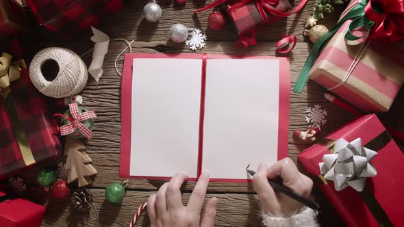 Top view of christmas greeting card on wooden table