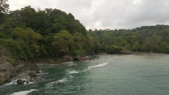 drone flight over the pacific ocean towards the beach of playa la vaca in costa rico