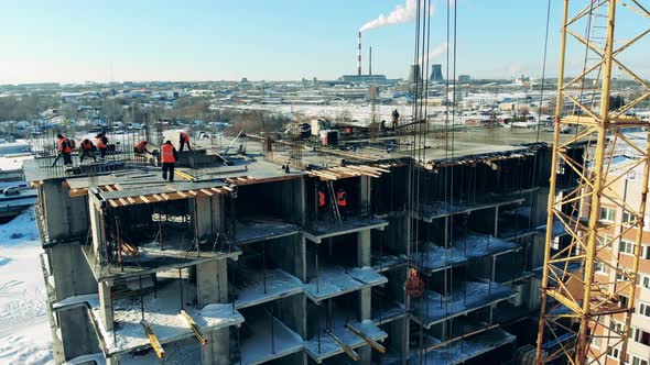 Construction Site Workers in Unfinished Building