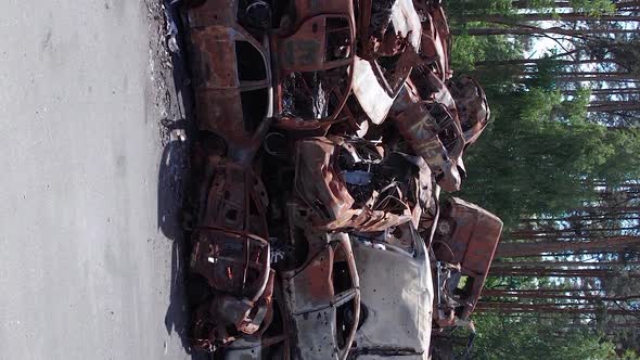 Vertical Video Irpin Bucha District  Destroyed Cars During the War in Ukraine
