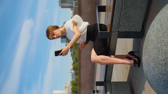 A Young Woman During Online Video Call in a Public Park