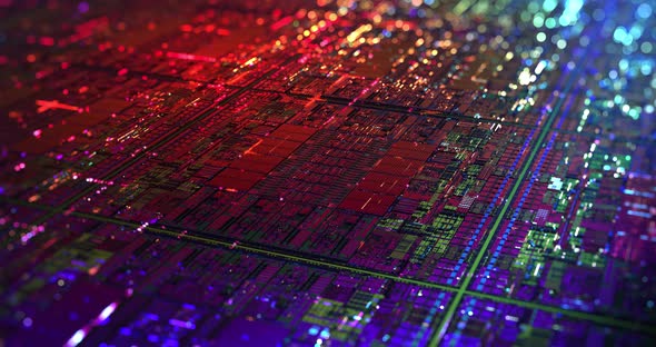 Iridescent Multi Colored Silicon Wafer with Data moving within circuitry. 