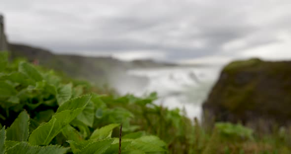 Gulfoss waterfalls in Iceland with gimbal video moving from ground up in slow motion.