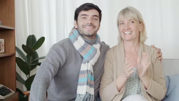 appiness caucasian couple dance move shake along with music melody on sofa