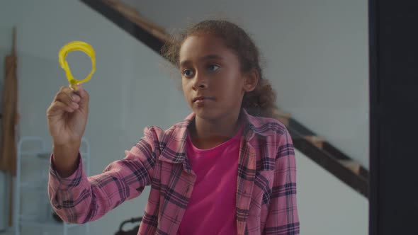 Lovely African Girl Painting Sun on Window Glass