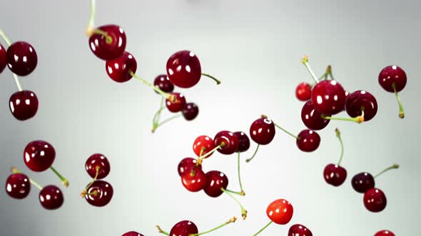 Red Cherry Falling Down on White Background