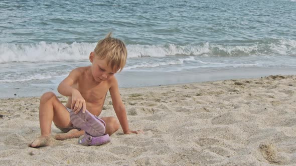 Little Boy Playing Near Sea