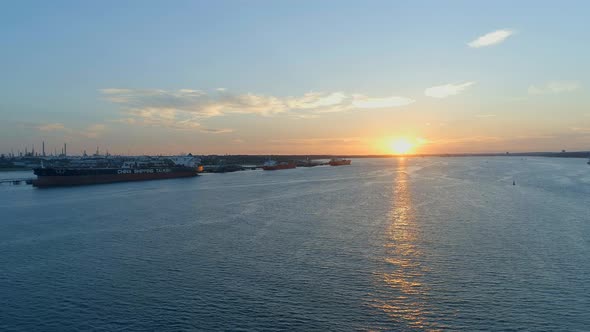 Sunset Over Southampton Docks With Ships Being Loaded With Cargo