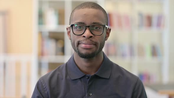 Portrait of Serious Young African Man Looking at the Camera