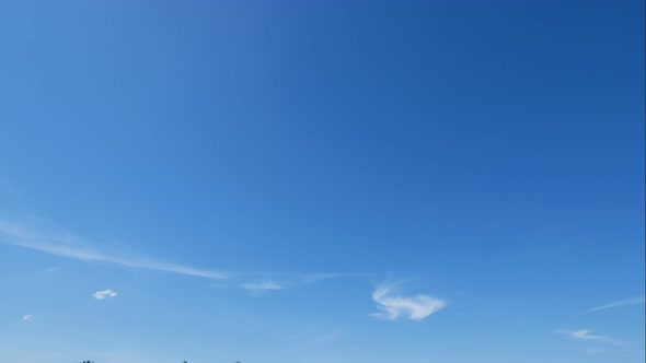 Time lapse of white cloud moving pass around sky background