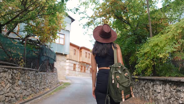 Young Woman Walking on the Street