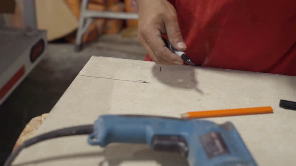 Closeup of power tool cutting a board