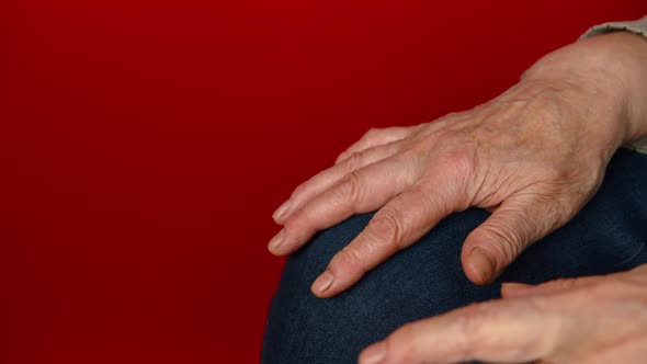 Elderly Woman's Hands on Knees