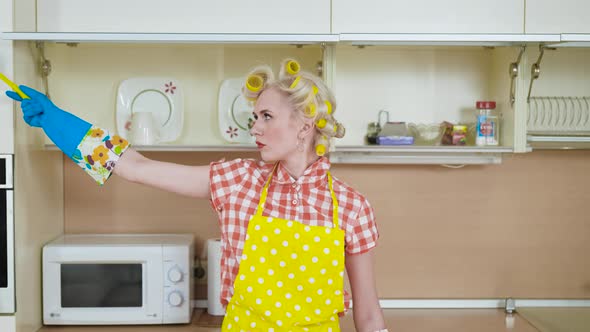 The Tortured Housewife Is Cleaning the Kitchen