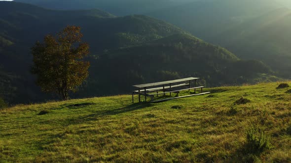 Bench Green Mountains Nobody Sit Against Impressive Rocky Landscape Sunlights