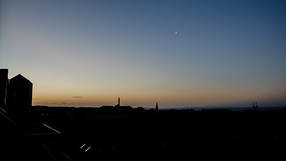 Sunrise Behind Large Buildings