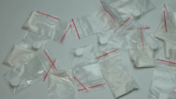 Many Small Portions of Cocaine on the Table
