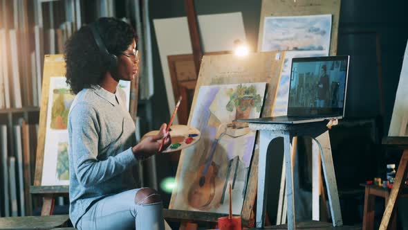 Africanamerican Woman is Having a Remote Painting Class