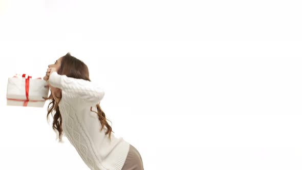  - Happy Caucasian Woman Dancing with Present Box in Christmas Day